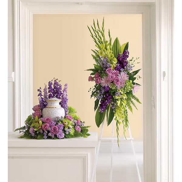 Floral arrangements with purple and green flowers on a white surface