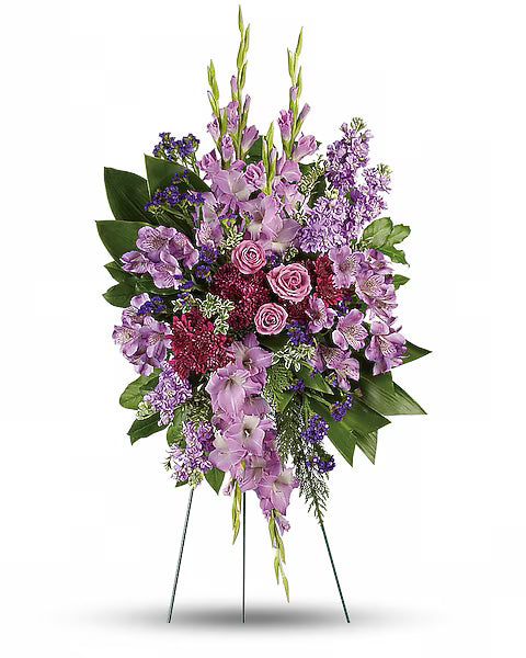 Bouquet of flowers with purple and pink hues on a white background