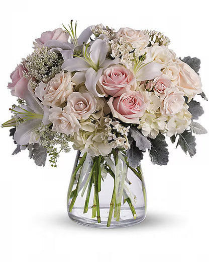 Colorful pink and white flower bouquet in glass vase