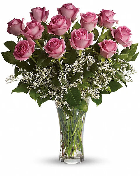 Bouquet of pink roses in a clear vase 