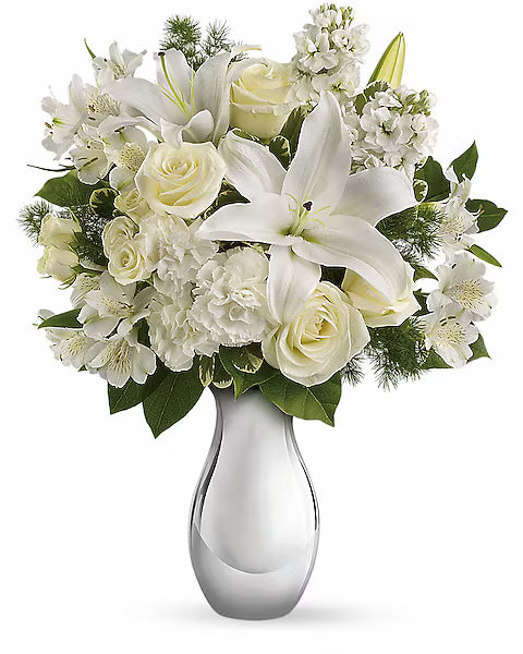 Simple and beautiful white flower arrangement in glass vase