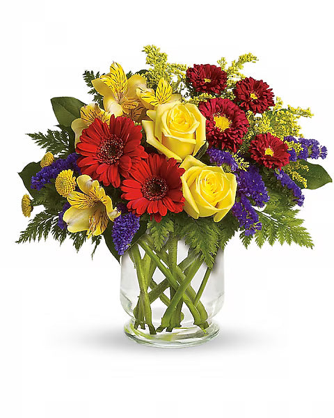 Colorful bouquet in a clear glass vase 