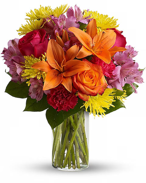 Bouquet of colorful flowers in a clear vase
