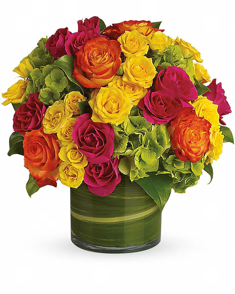 Mixed roses in a green vase, white backdrop