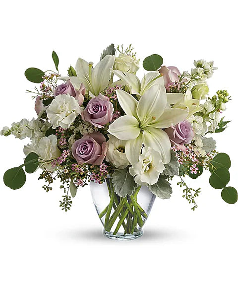 Bouquet of Decorative flowers in a clear vase 